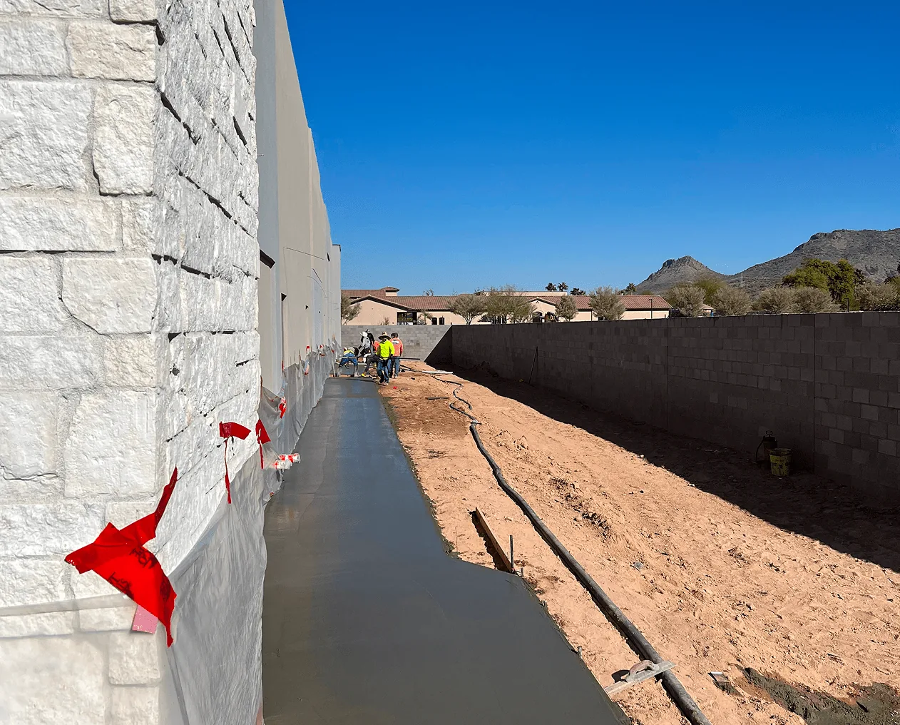 Waterproofed concrete stem wall and footing trench on a Phoenix, AZ home site